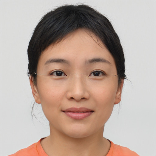 Joyful asian young-adult female with medium  black hair and brown eyes