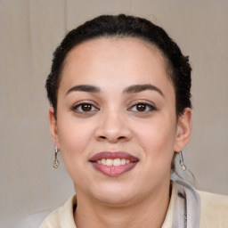 Joyful latino young-adult female with short  brown hair and brown eyes