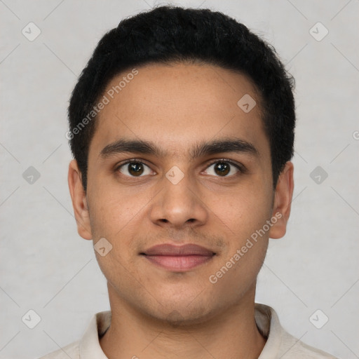 Joyful latino young-adult male with short  black hair and brown eyes