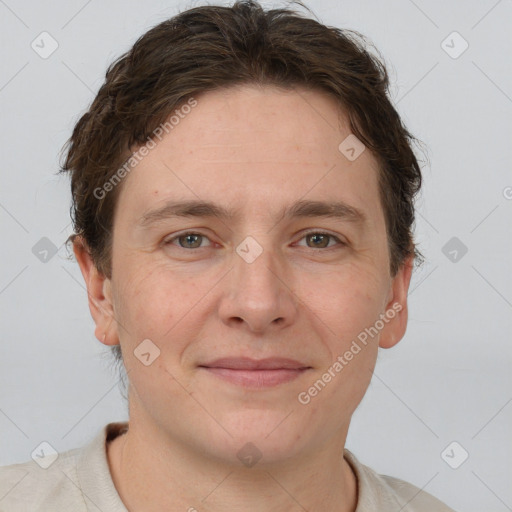 Joyful white adult male with short  brown hair and grey eyes