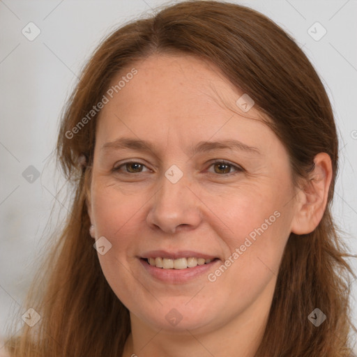 Joyful white adult female with long  brown hair and grey eyes