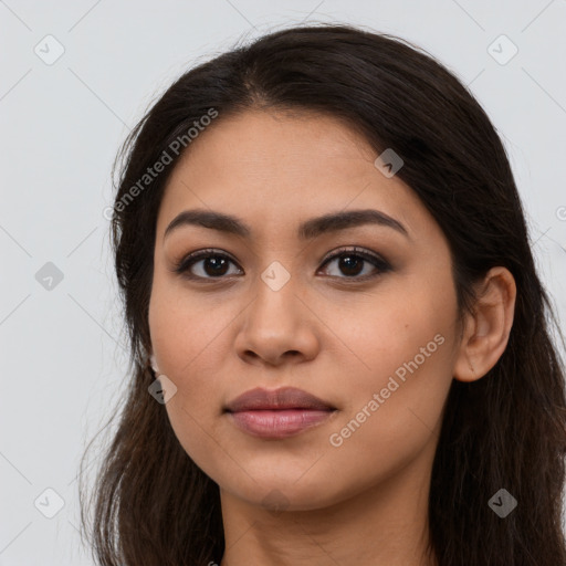 Joyful latino young-adult female with long  brown hair and brown eyes