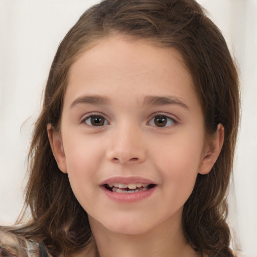 Joyful white child female with long  brown hair and brown eyes