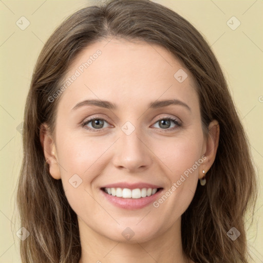 Joyful white young-adult female with long  brown hair and green eyes