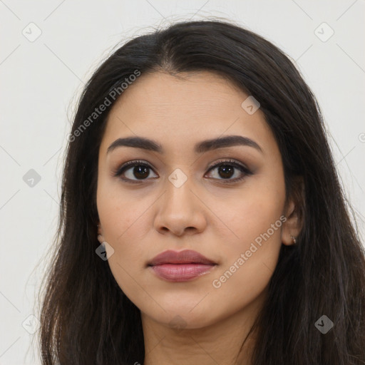 Joyful latino young-adult female with long  black hair and brown eyes