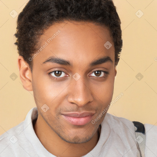 Joyful black young-adult male with short  brown hair and brown eyes