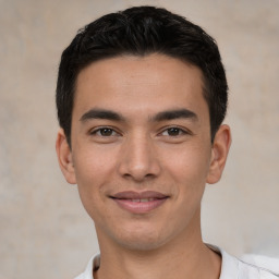 Joyful white young-adult male with short  black hair and brown eyes