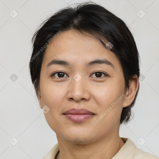 Joyful asian young-adult female with medium  brown hair and brown eyes