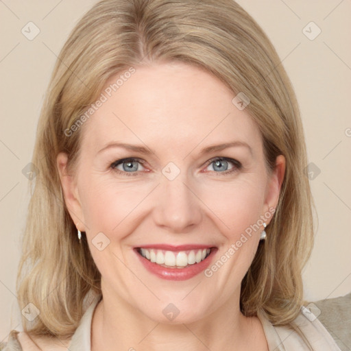 Joyful white young-adult female with medium  brown hair and blue eyes