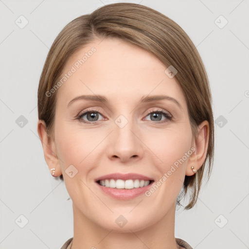 Joyful white young-adult female with medium  brown hair and grey eyes