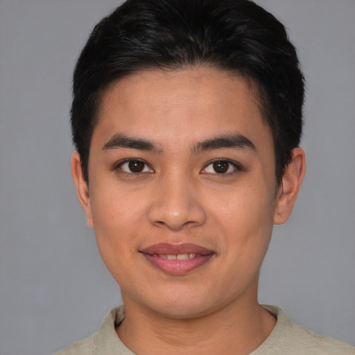 Joyful asian young-adult male with short  brown hair and brown eyes