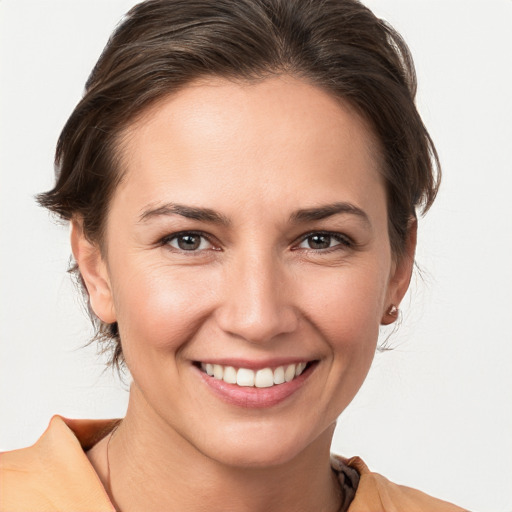 Joyful white young-adult female with medium  brown hair and brown eyes