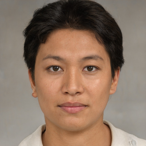 Joyful asian young-adult female with short  brown hair and brown eyes
