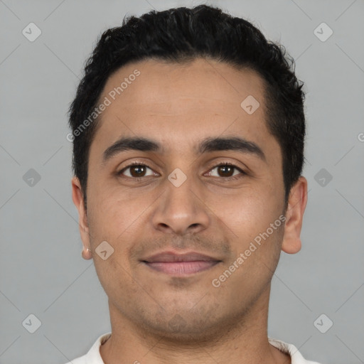 Joyful latino young-adult male with short  black hair and brown eyes