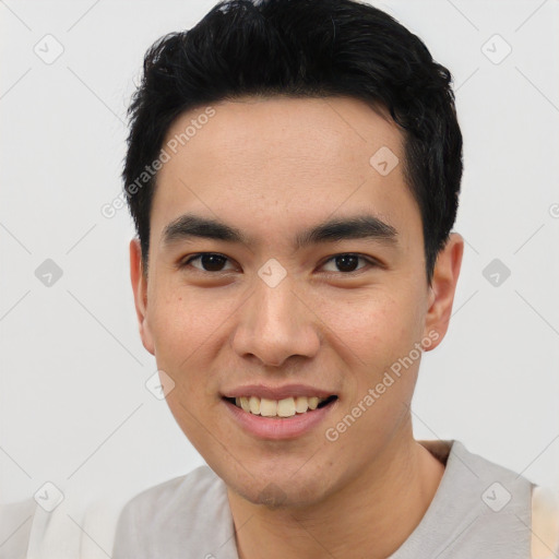 Joyful asian young-adult male with short  black hair and brown eyes