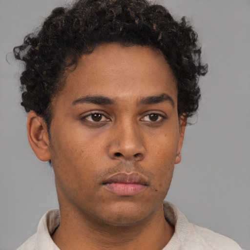 Neutral black young-adult male with short  brown hair and brown eyes