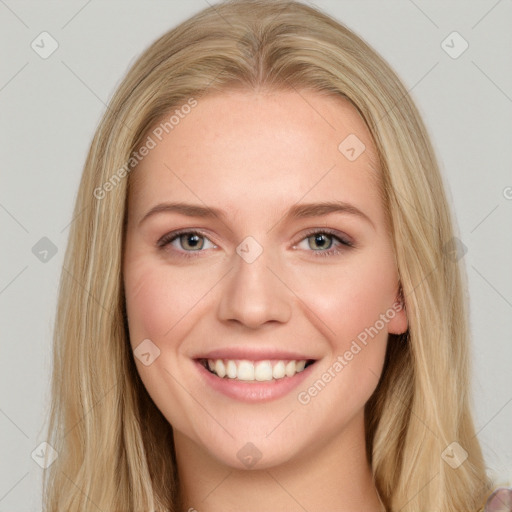 Joyful white young-adult female with long  brown hair and blue eyes