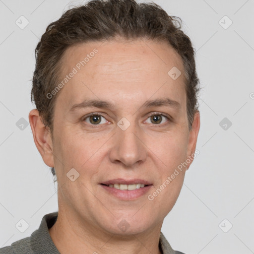 Joyful white adult male with short  brown hair and grey eyes