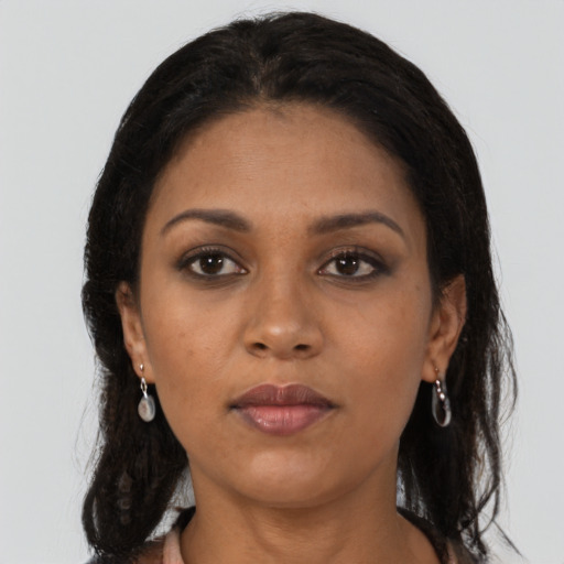 Neutral black young-adult female with long  brown hair and brown eyes