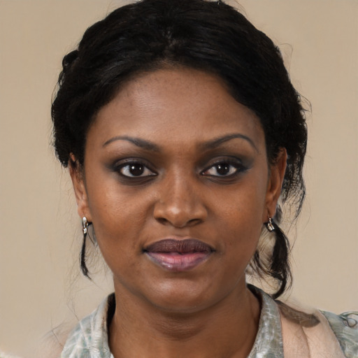 Joyful black young-adult female with medium  black hair and brown eyes