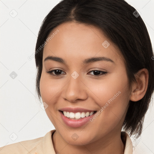 Joyful white young-adult female with medium  brown hair and brown eyes