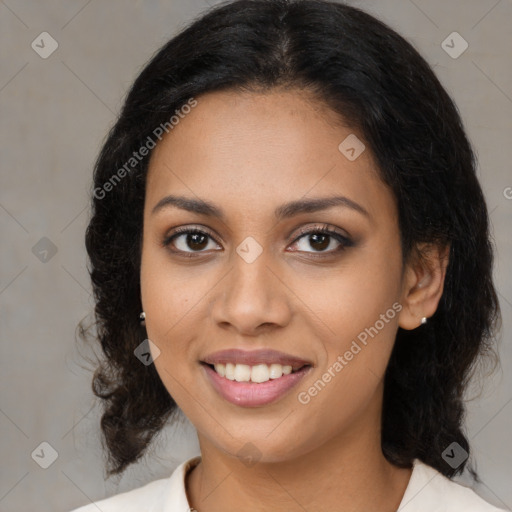 Joyful latino young-adult female with medium  brown hair and brown eyes