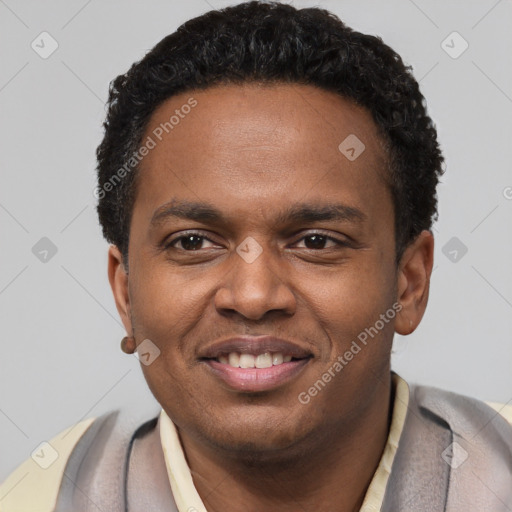 Joyful black young-adult male with short  black hair and brown eyes