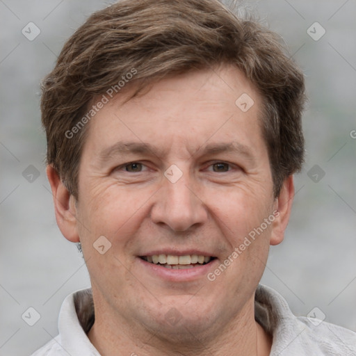 Joyful white adult male with short  brown hair and grey eyes