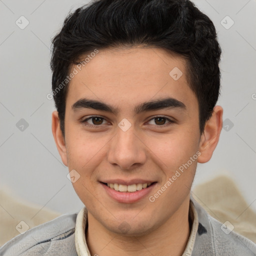 Joyful latino young-adult male with short  brown hair and brown eyes