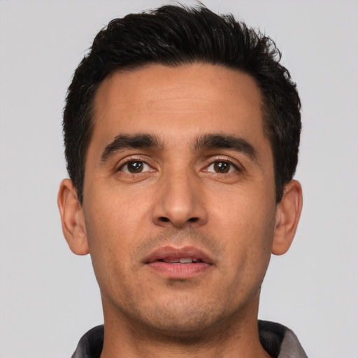 Neutral latino young-adult male with short  black hair and brown eyes