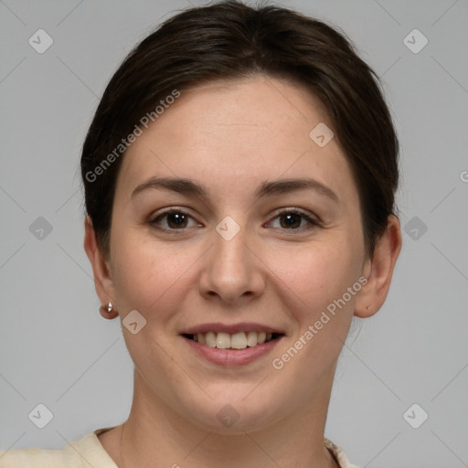 Joyful white young-adult female with short  brown hair and grey eyes