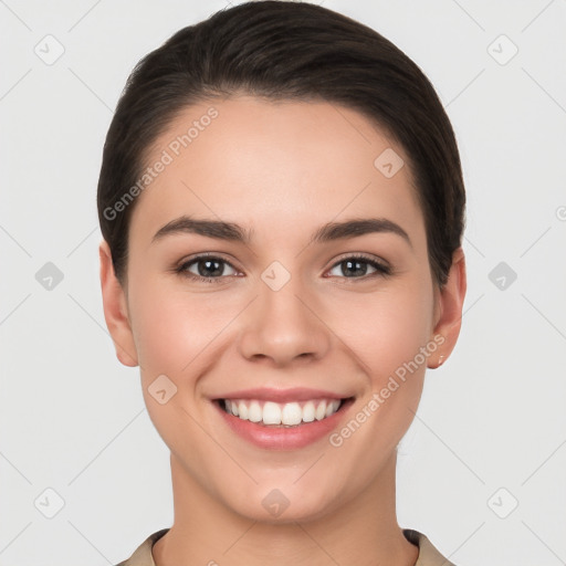 Joyful white young-adult female with short  brown hair and brown eyes