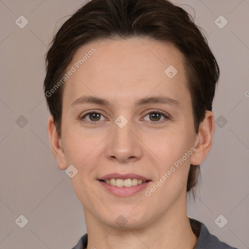 Joyful white adult female with short  brown hair and brown eyes