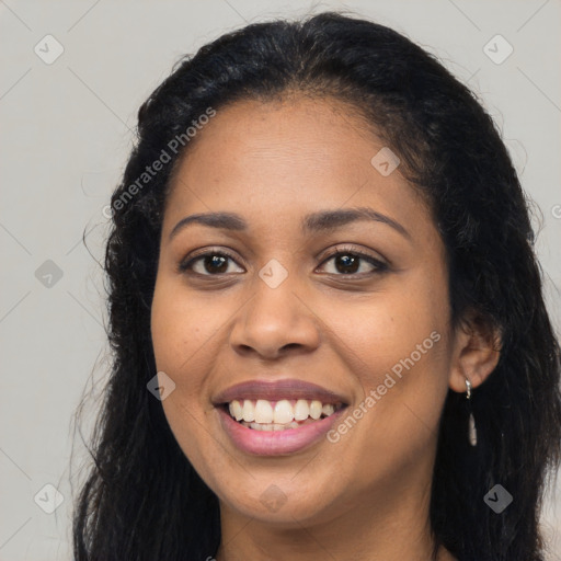 Joyful latino young-adult female with long  brown hair and brown eyes