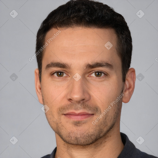 Joyful white young-adult male with short  brown hair and brown eyes