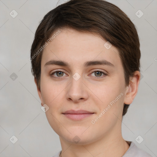 Joyful white young-adult female with short  brown hair and brown eyes