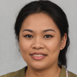 Joyful asian young-adult female with medium  brown hair and brown eyes