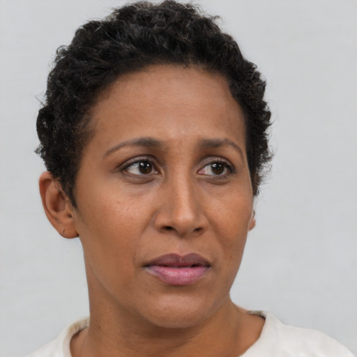 Neutral black adult female with short  brown hair and brown eyes