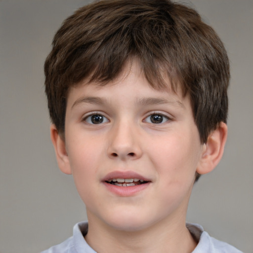 Joyful white child male with short  brown hair and brown eyes