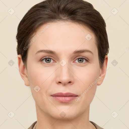 Joyful white young-adult female with short  brown hair and grey eyes