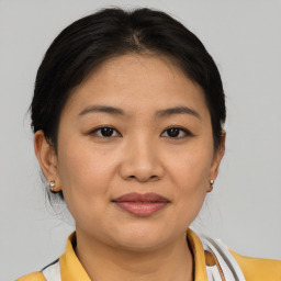 Joyful asian young-adult female with medium  brown hair and brown eyes