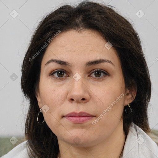 Joyful white adult female with medium  brown hair and brown eyes