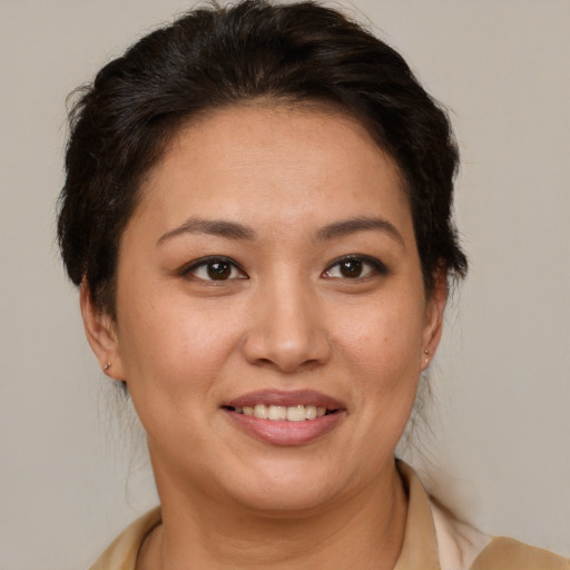 Joyful white young-adult female with medium  brown hair and brown eyes