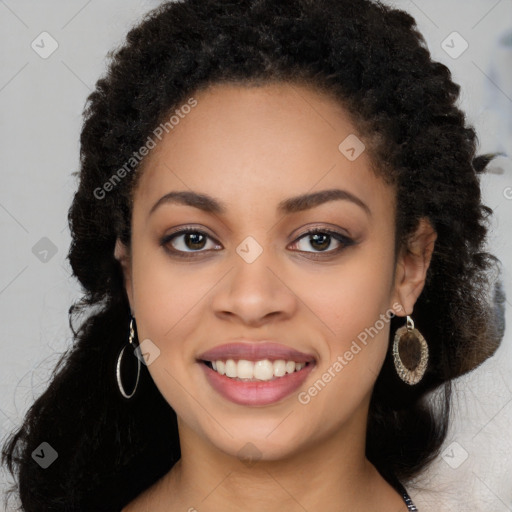 Joyful black young-adult female with long  brown hair and brown eyes