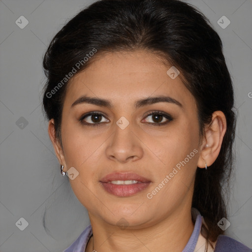 Joyful latino young-adult female with medium  brown hair and brown eyes