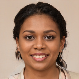 Joyful black young-adult female with medium  brown hair and brown eyes