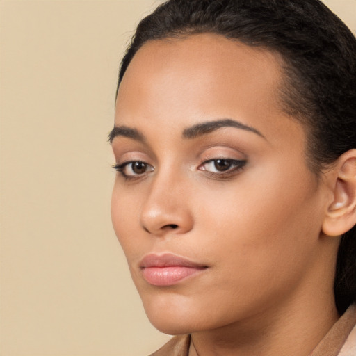 Neutral latino young-adult female with long  brown hair and brown eyes