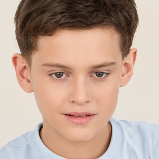 Joyful white child male with short  brown hair and brown eyes