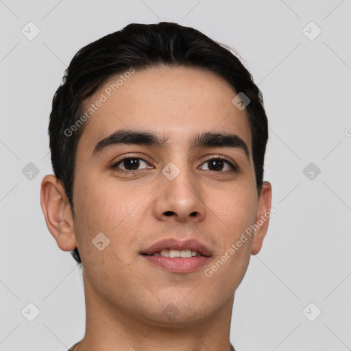 Joyful white young-adult male with short  black hair and brown eyes