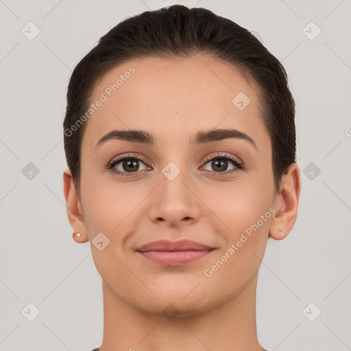 Joyful white young-adult female with short  brown hair and brown eyes